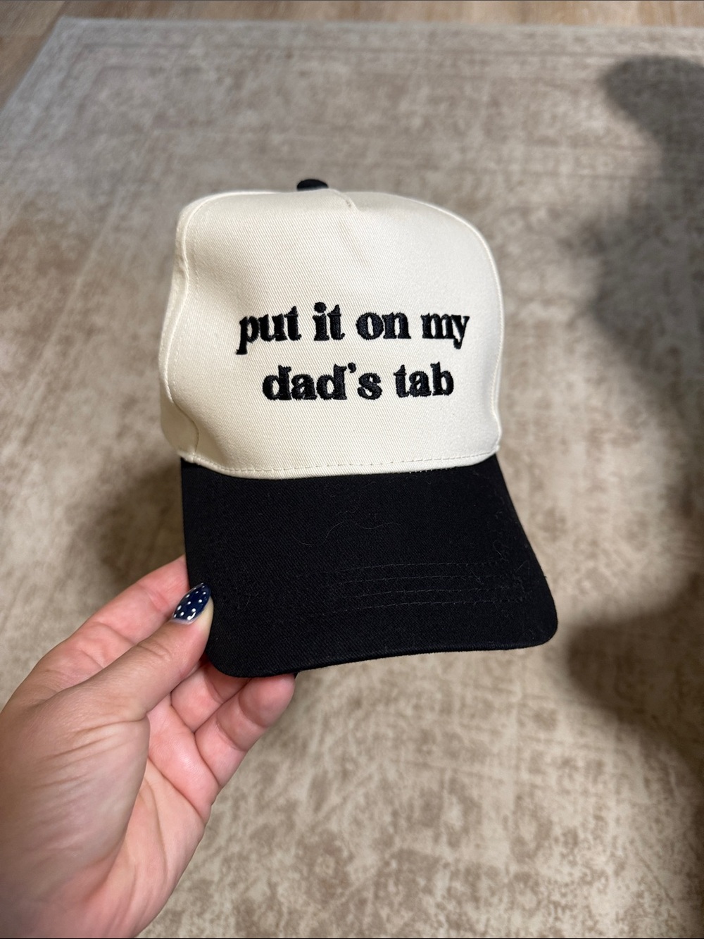 Cream and Black Trucker Hat with 'put it on my dad's tab' Embroidery